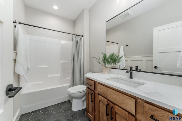 full bathroom with toilet, tile patterned floors, shower / bathtub combination with curtain, and vanity