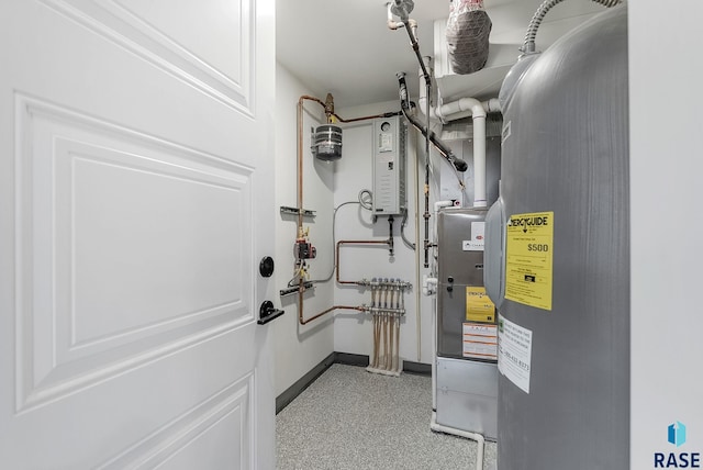 utility room featuring water heater