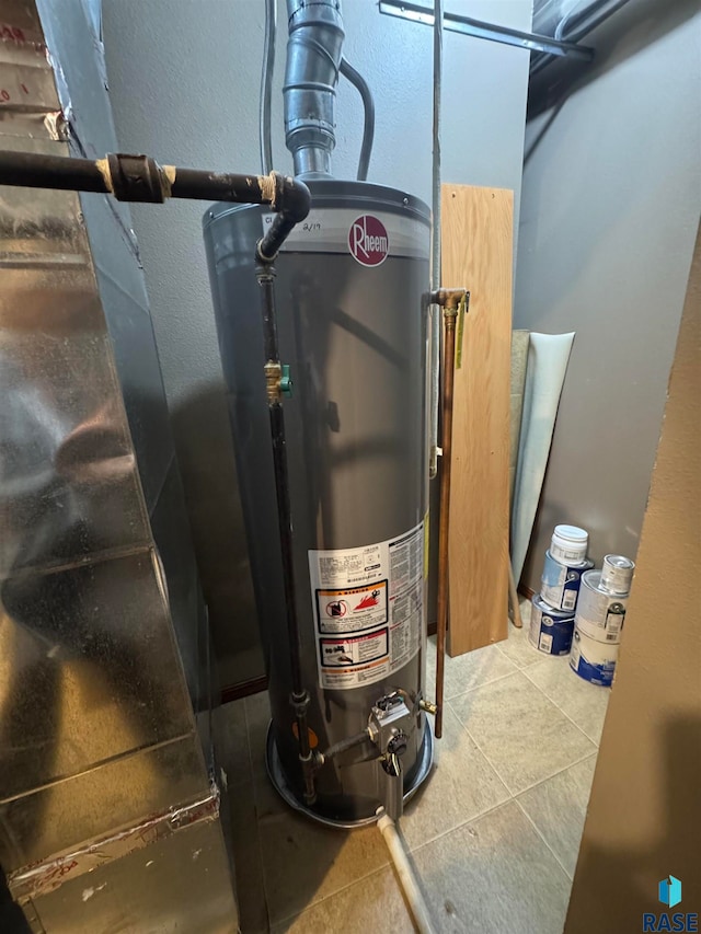 utility room with gas water heater