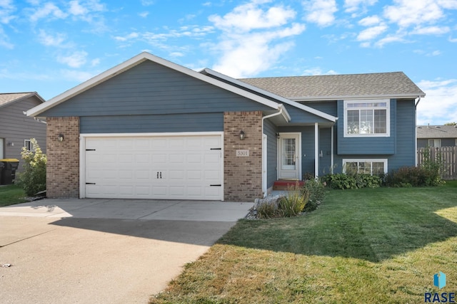 view of front facade featuring a garage and a front lawn