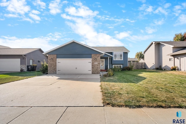 view of front of home with a front yard and a garage