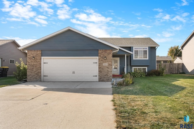 view of front of house featuring a front yard and a garage