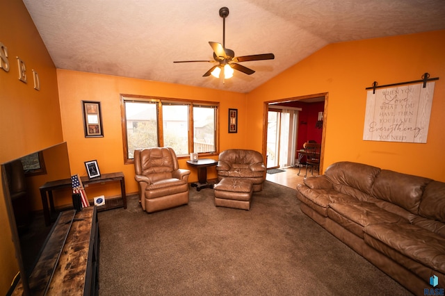 living area with vaulted ceiling, carpet, and ceiling fan