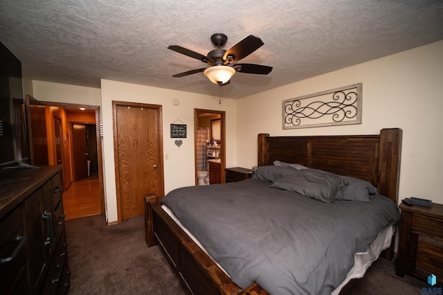 bedroom featuring a ceiling fan, dark colored carpet, a closet, and a textured ceiling