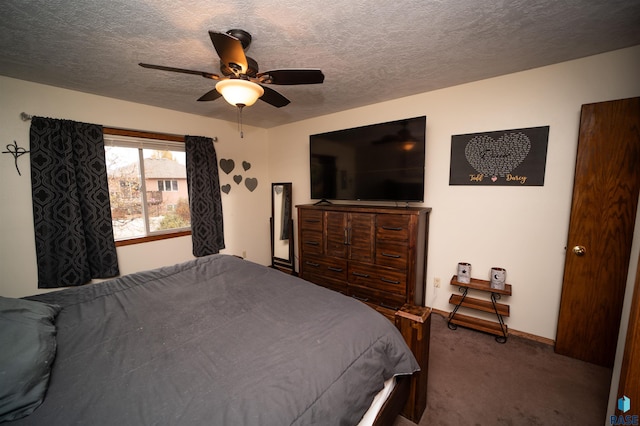 bedroom with baseboards, a textured ceiling, ceiling fan, and carpet flooring