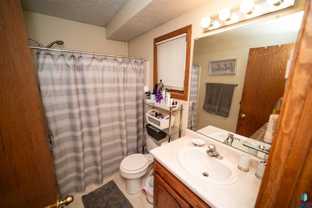 bathroom with curtained shower, toilet, vanity, and a textured ceiling