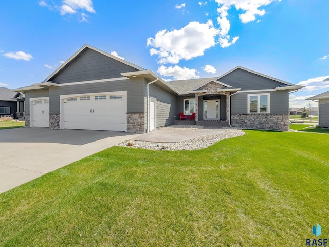 view of front of house featuring a garage and a front yard