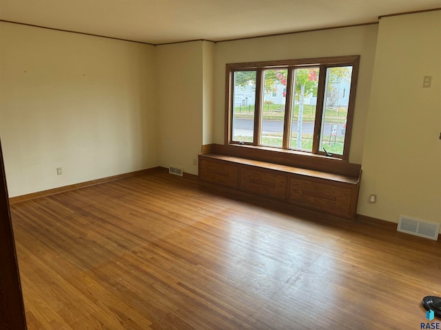 unfurnished room featuring light wood-type flooring