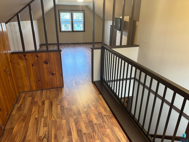 interior space featuring hardwood / wood-style floors and vaulted ceiling