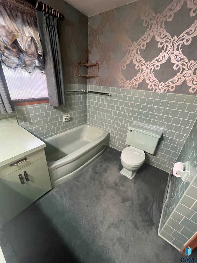 bathroom with toilet, tile walls, and a tub