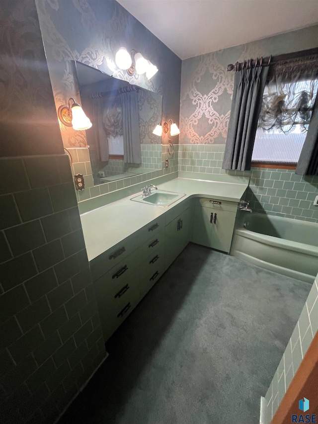 bathroom featuring a tub to relax in and sink