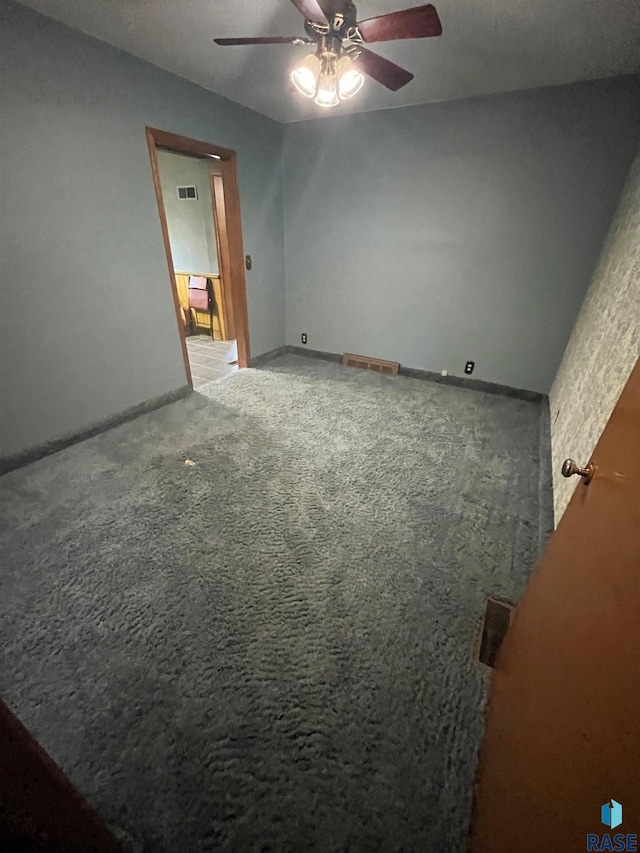 unfurnished bedroom featuring carpet flooring and ceiling fan