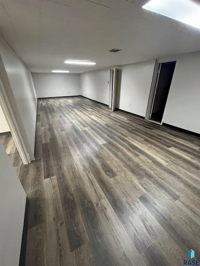 spare room featuring dark hardwood / wood-style flooring