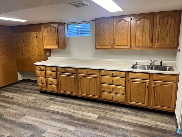 kitchen with sink and dark hardwood / wood-style flooring