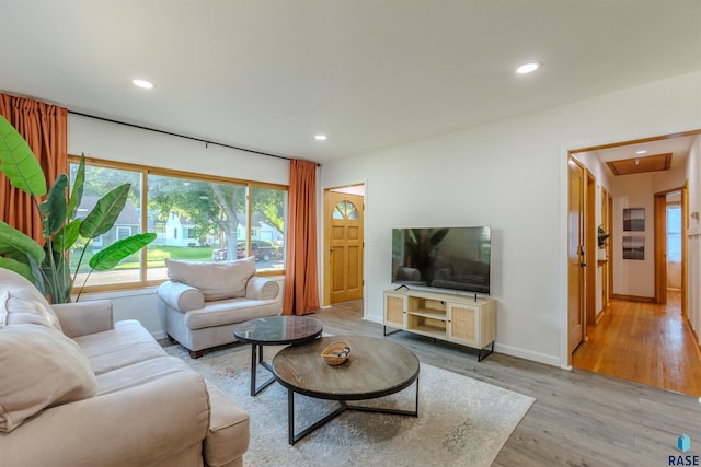 living room with light hardwood / wood-style floors