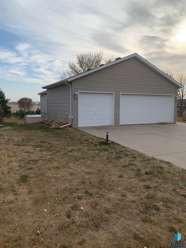 garage with a lawn