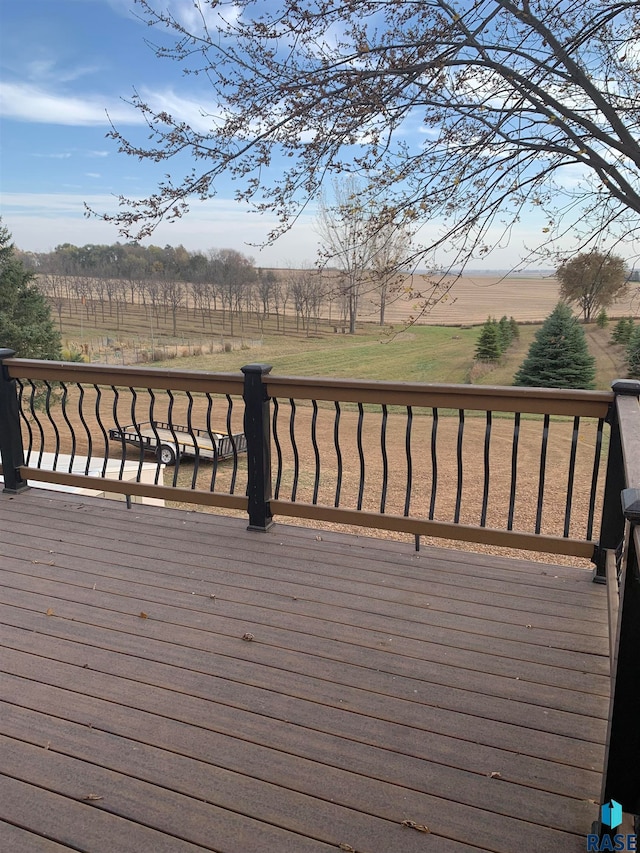 wooden deck featuring a rural view