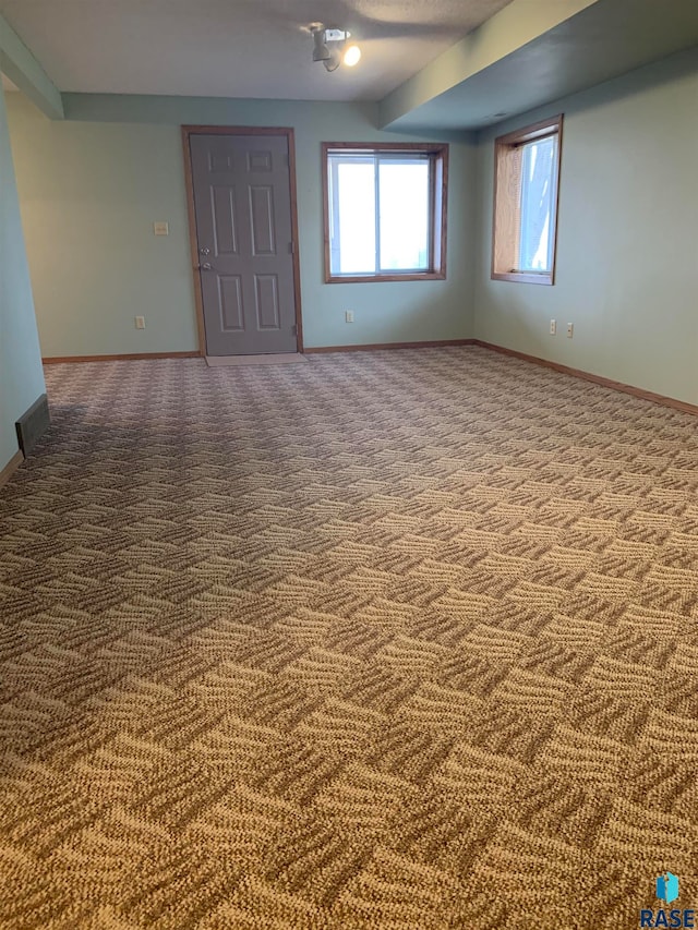 spare room featuring carpet