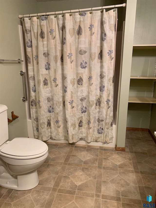 bathroom featuring toilet