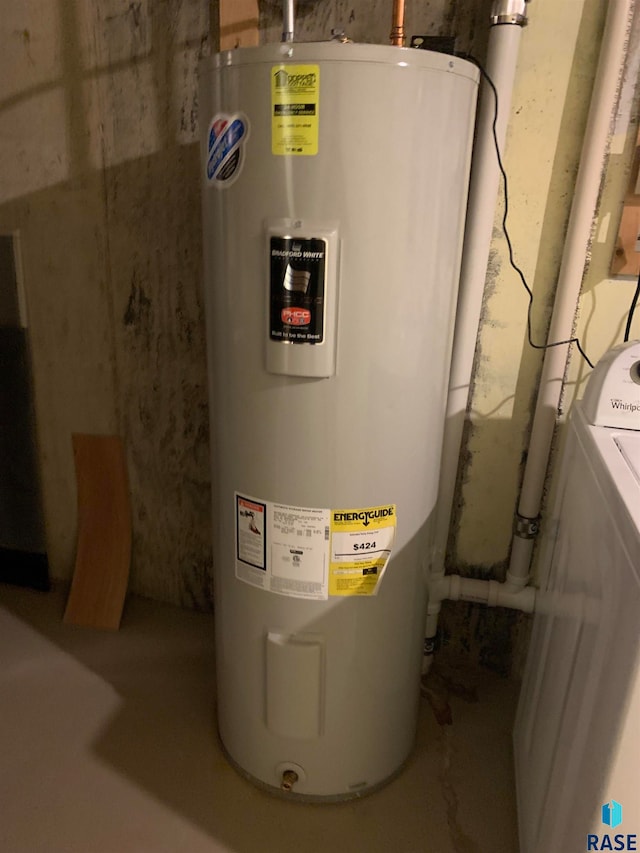 utility room featuring water heater and washer / clothes dryer