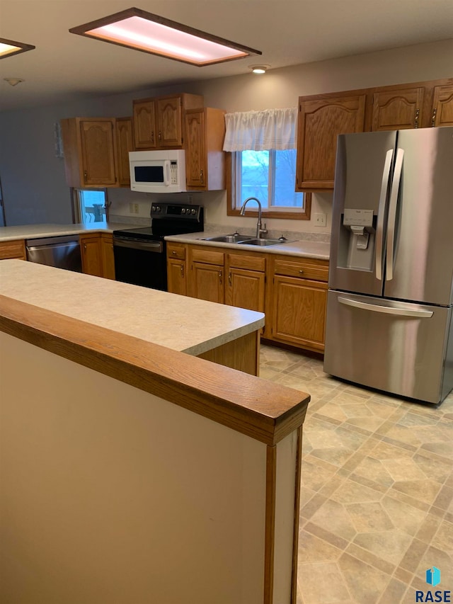 kitchen featuring stainless steel appliances and sink