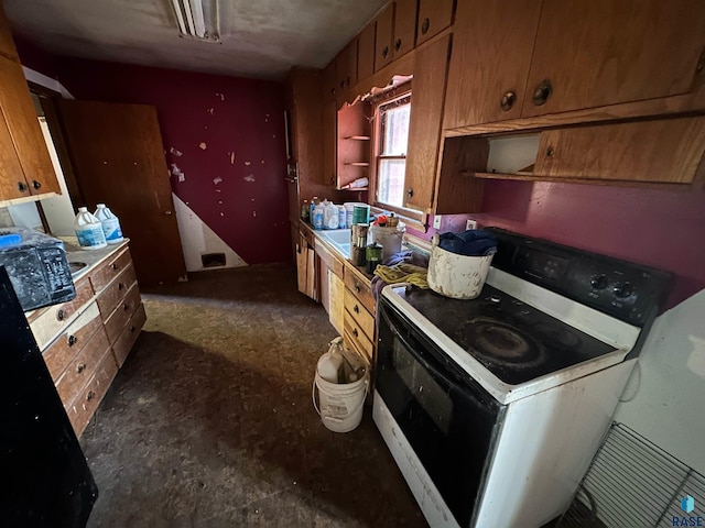 kitchen featuring white electric stove