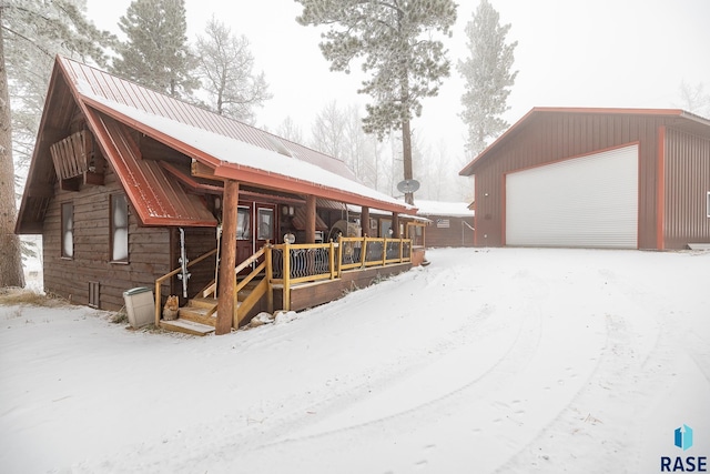 exterior space with an outbuilding and a garage