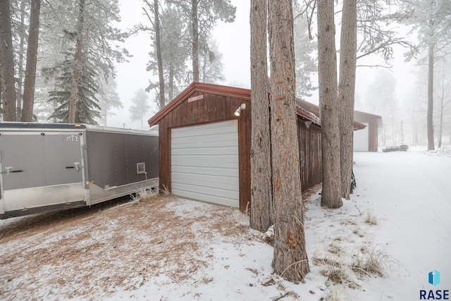 view of snow covered garage