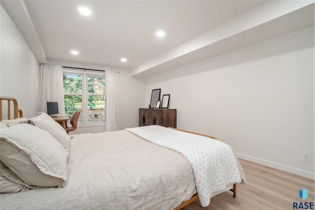 bedroom with hardwood / wood-style floors