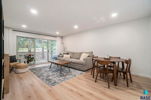 living room with light hardwood / wood-style flooring