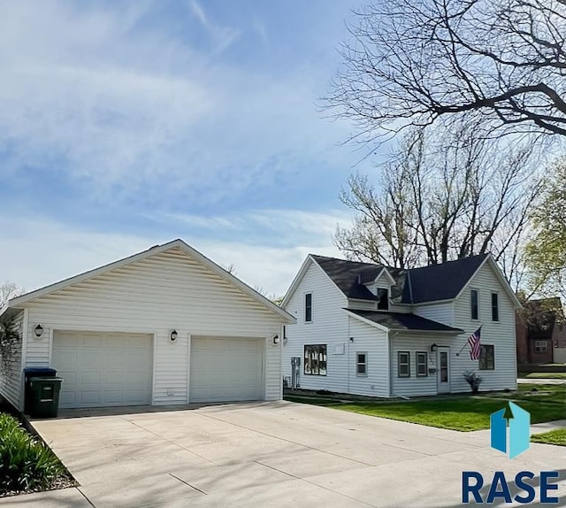 323 W Lincoln St, Luverne, MN 56156 - view of front of property featuring a detached garage and an outbuilding