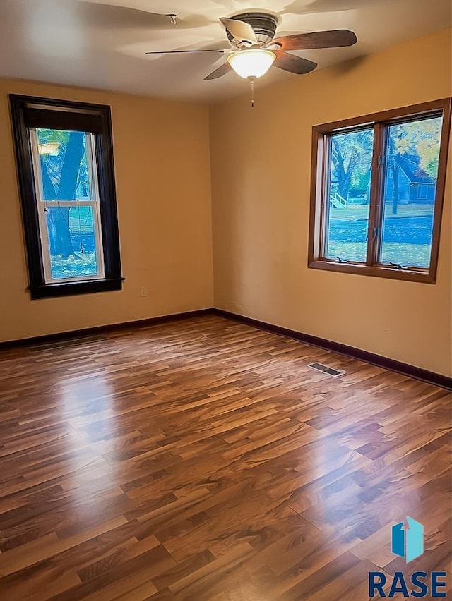 323 W Lincoln St, Luverne, MN 56156 - unfurnished room featuring wood finished floors, ceiling fan, and baseboards