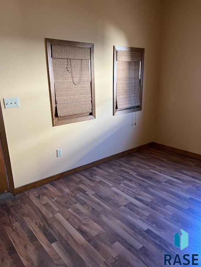 323 W Lincoln St, Luverne, MN 56156 - spare room featuring wood finished floors and baseboards