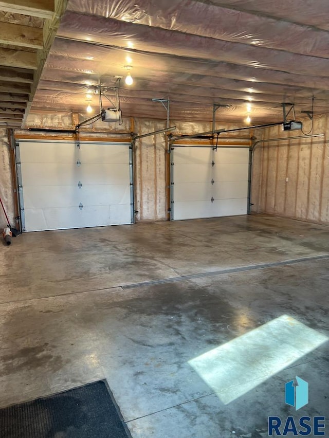 323 W Lincoln St, Luverne, MN 56156 - garage featuring a garage door opener