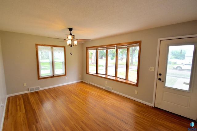 entrance foyer featuring wood-type flooring and ceiling fan