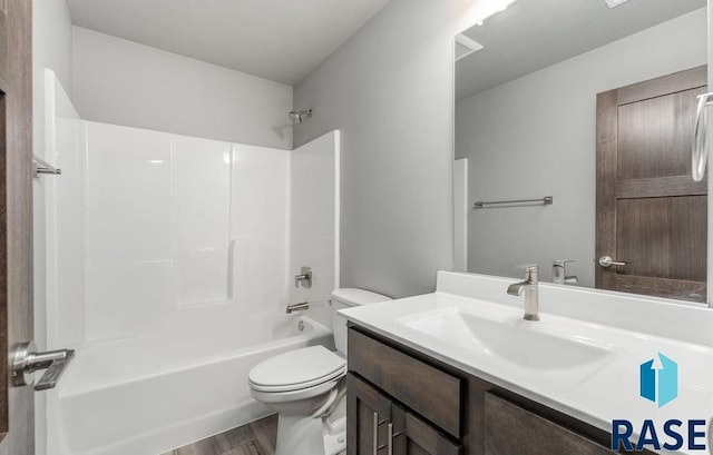 705 Sarah C St, Garretson, SD 57030 - bathroom with toilet, vanity, wood finished floors, and bathing tub / shower combination