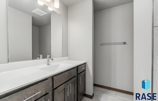 705 Sarah C St, Garretson, SD 57030 - bathroom featuring vanity and baseboards