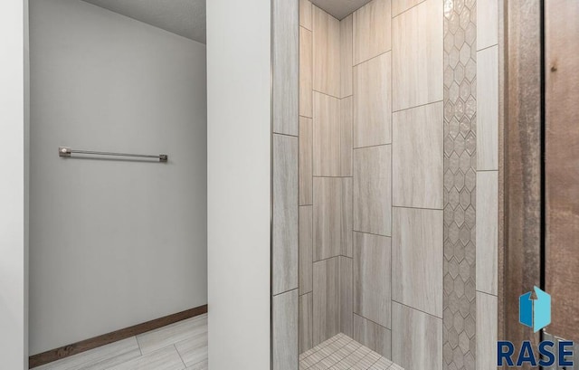 705 Sarah C St, Garretson, SD 57030 - bathroom with tiled shower and baseboards