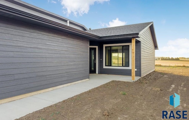 doorway to property with a patio