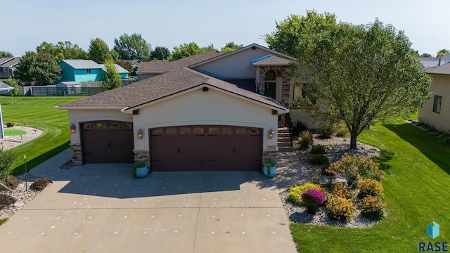 view of front of house with a front lawn and a garage