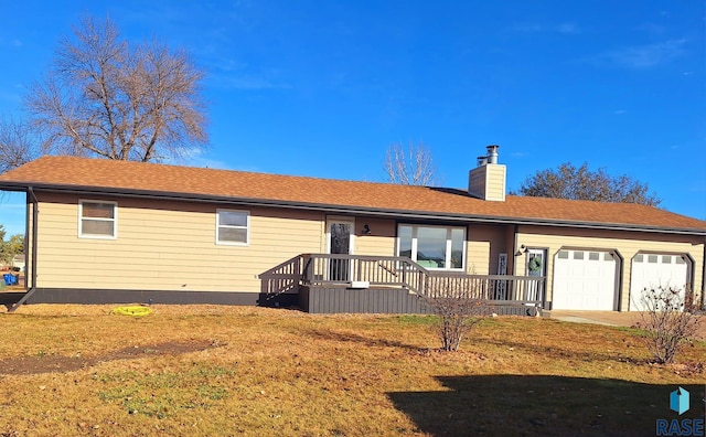 ranch-style house with a garage and a front lawn