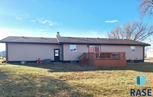 back of house with a lawn and a wooden deck