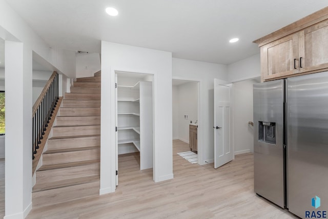 stairs featuring wood-type flooring