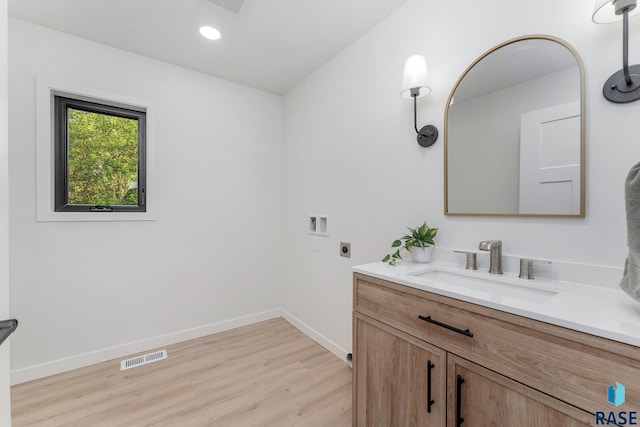 bathroom featuring vanity and hardwood / wood-style floors