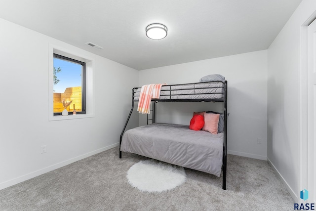 bedroom with light colored carpet