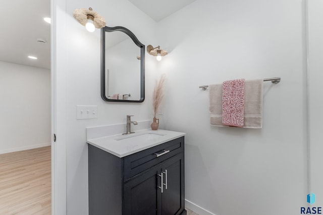 bathroom featuring hardwood / wood-style floors and vanity