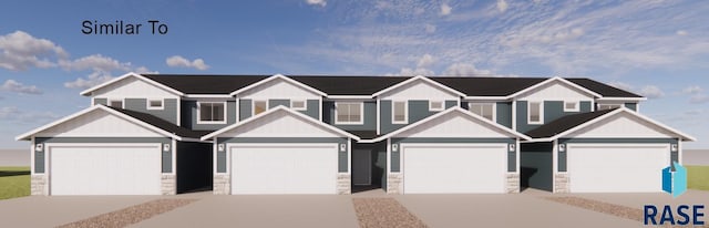 1249 N Marion Rd Unit 1, Sioux Falls, SD 57107 - view of property with stone siding, board and batten siding, and driveway