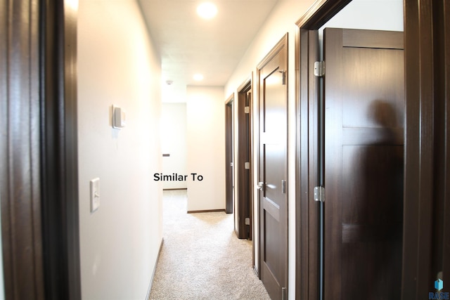 hallway with light carpet