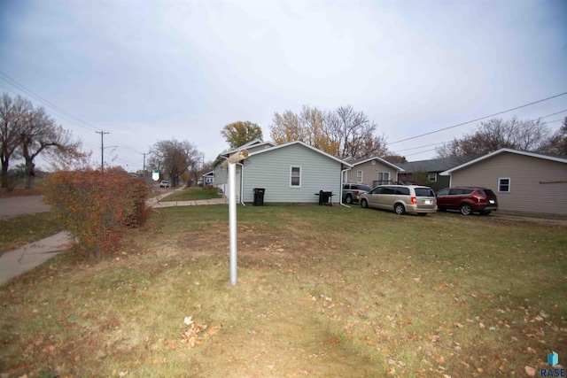 view of property exterior with a yard