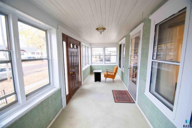 sunroom / solarium featuring wood ceiling